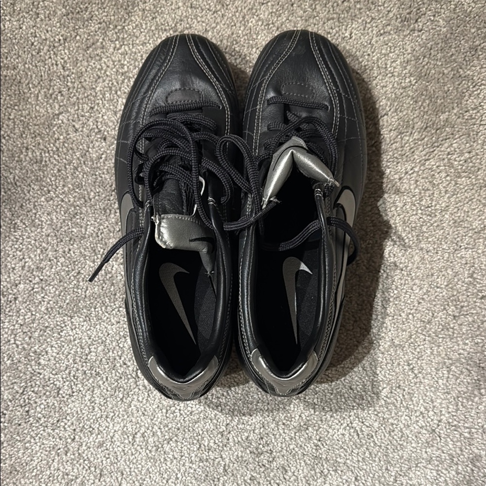 Nike Black and Silver cleats (women’s)